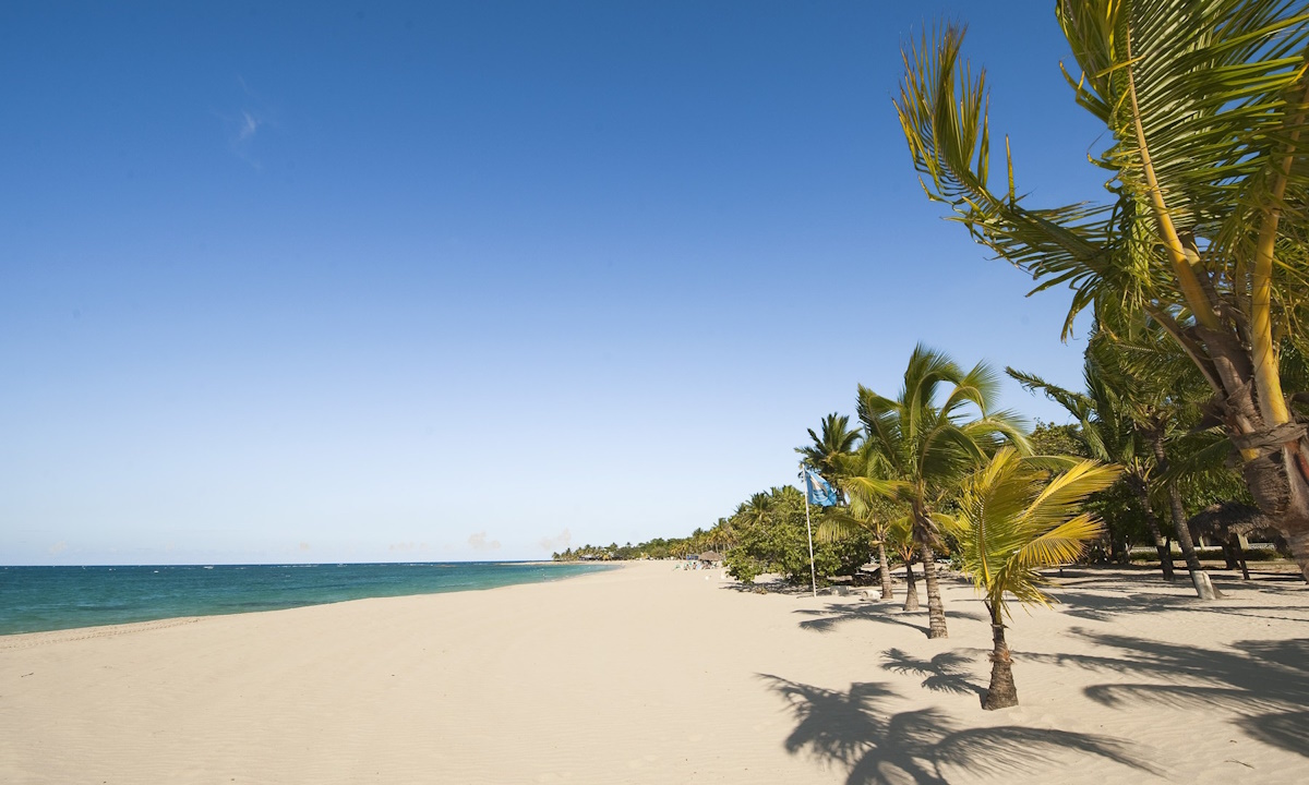 Playa Dorada with its golden sand and beach umbrellas